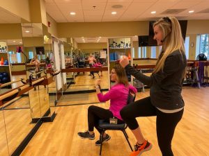 A fitness instructor leading a group class