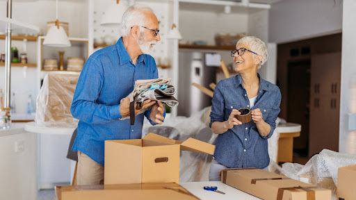 couple using their downsizing checklist for seniors to make moving easy