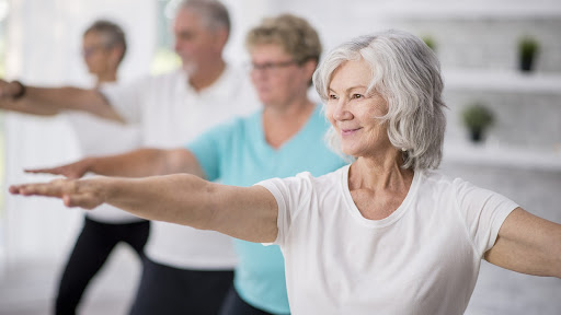 people in a class for yoga and meditation for seniors