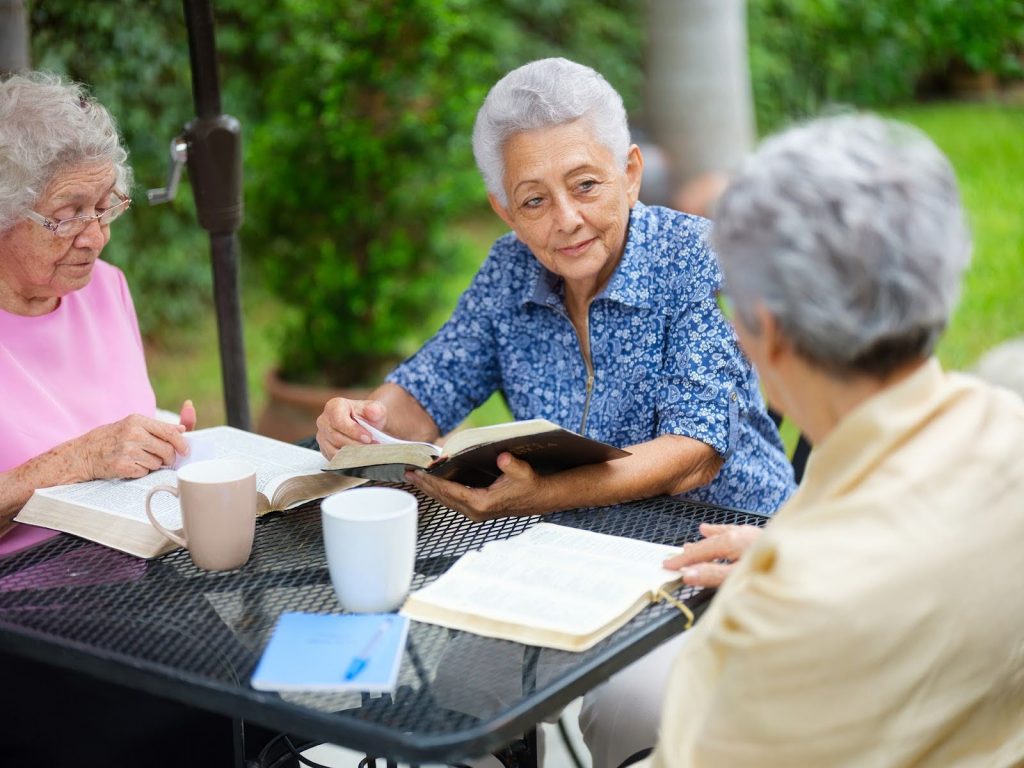 Senior women having a book club meeting.