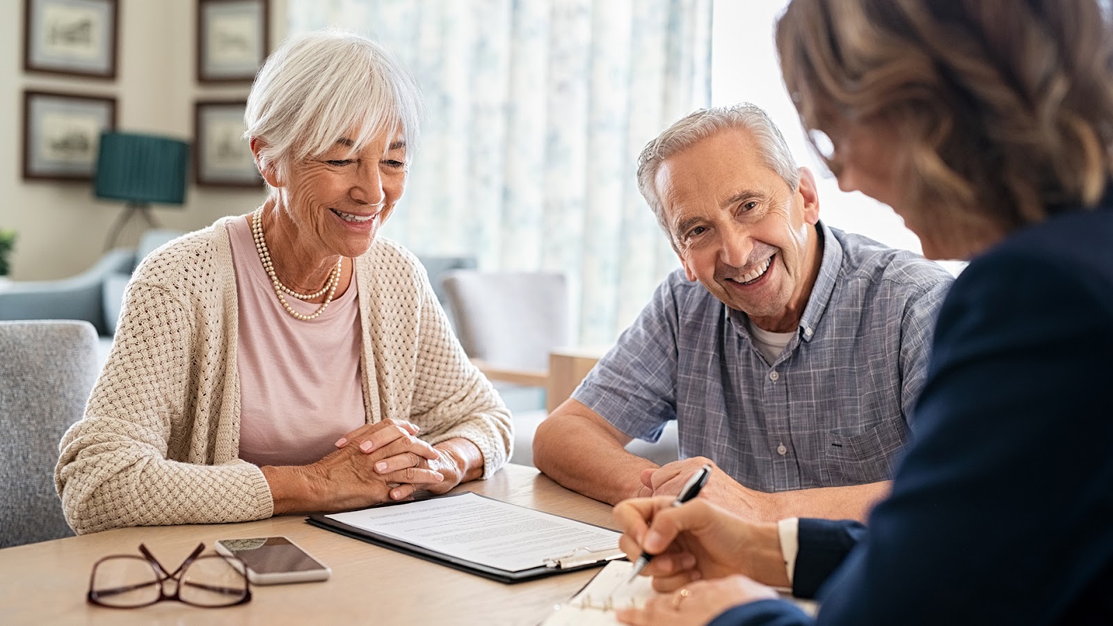 senior couple learning about entrance fees for retirement communities with their financial advisor