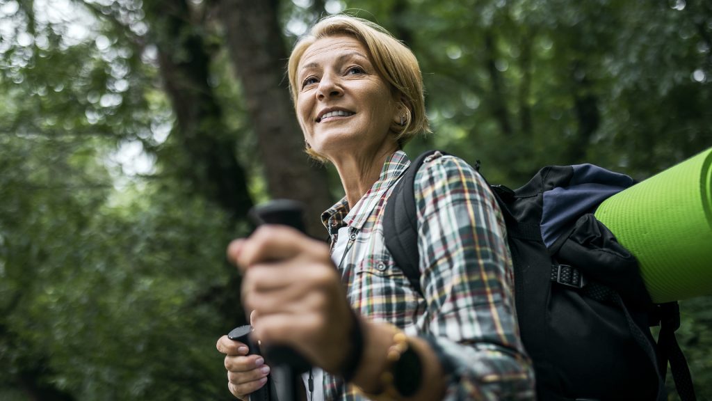 woman enjoying hiking and being active in retirement